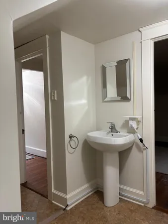 a bathroom with a sink and mirror