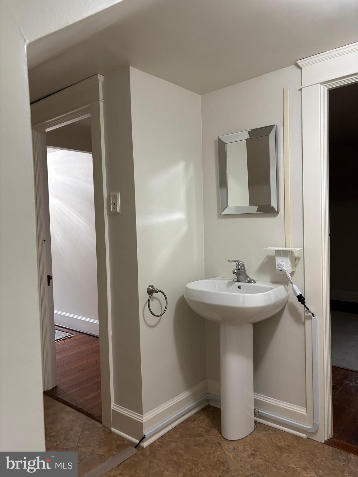 1121 Spring Grove Avenue Lancaster, PA 17603 - Photo 19 of 25 a bathroom with a sink and mirror