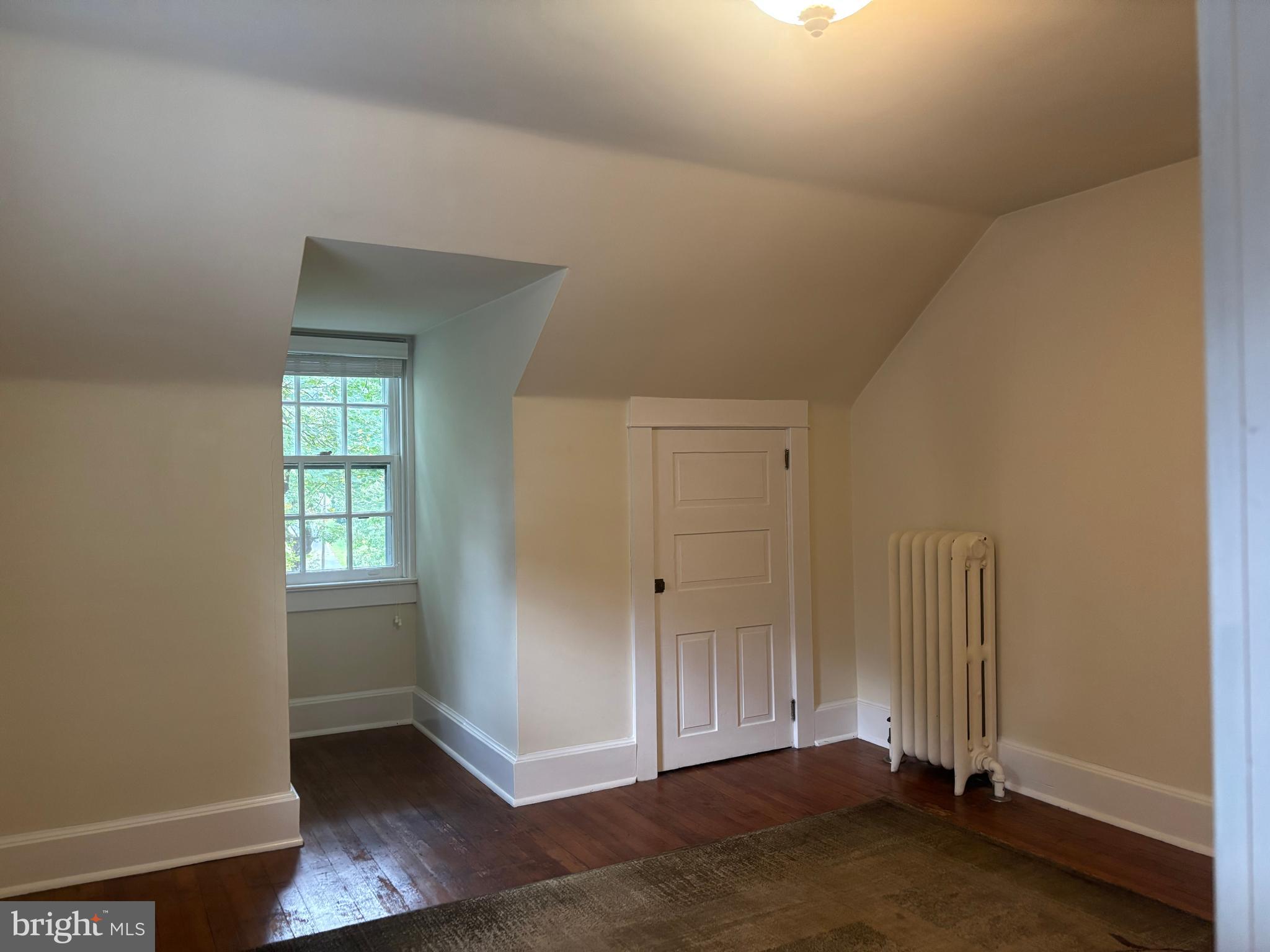 1121 Spring Grove Avenue Lancaster, PA 17603 - Photo 20 of 25 an empty room with wooden floor and windows