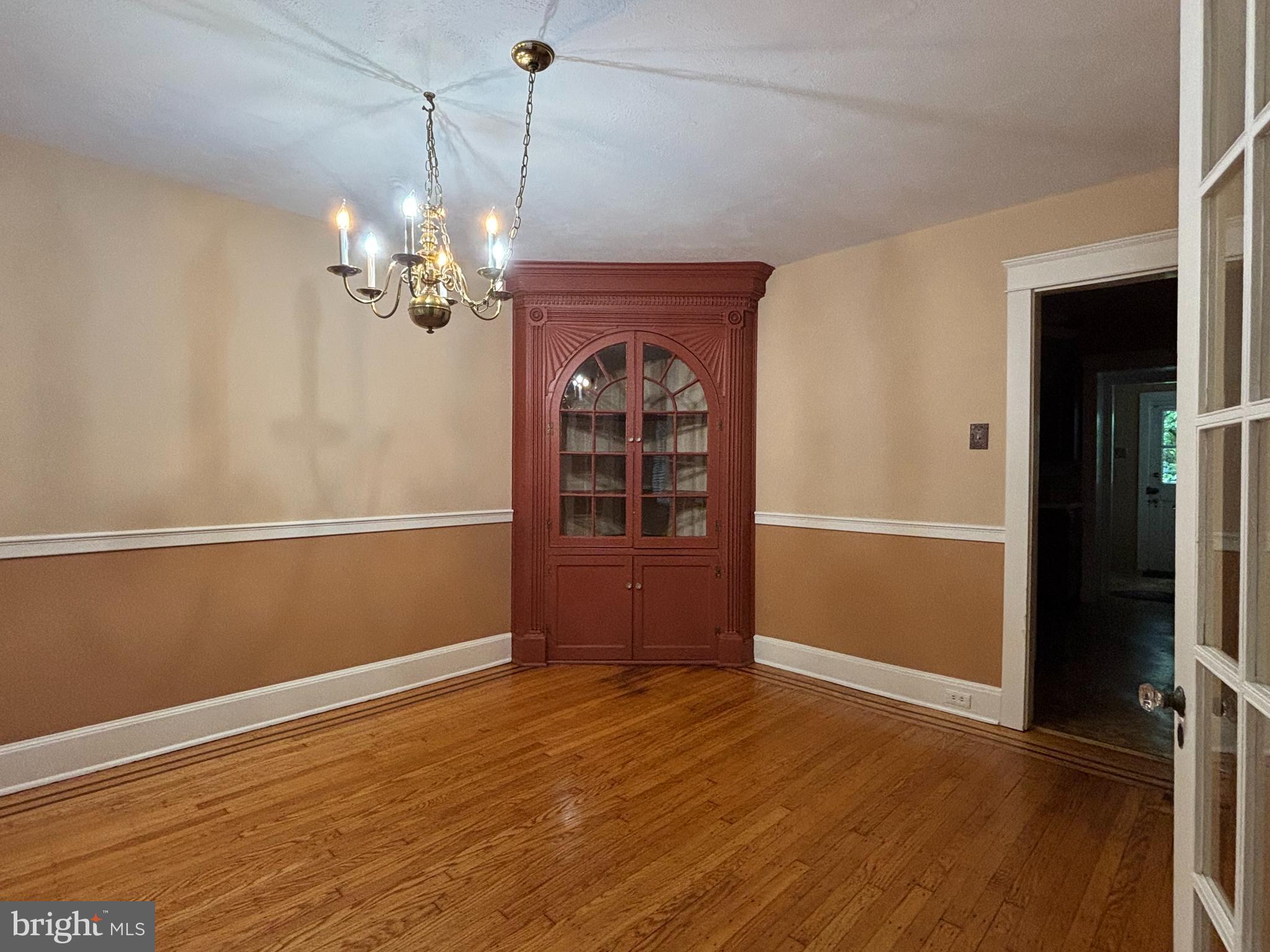 1121 Spring Grove Avenue Lancaster, PA 17603 - Photo 5 of 23 wooden floor in an empty room with a window