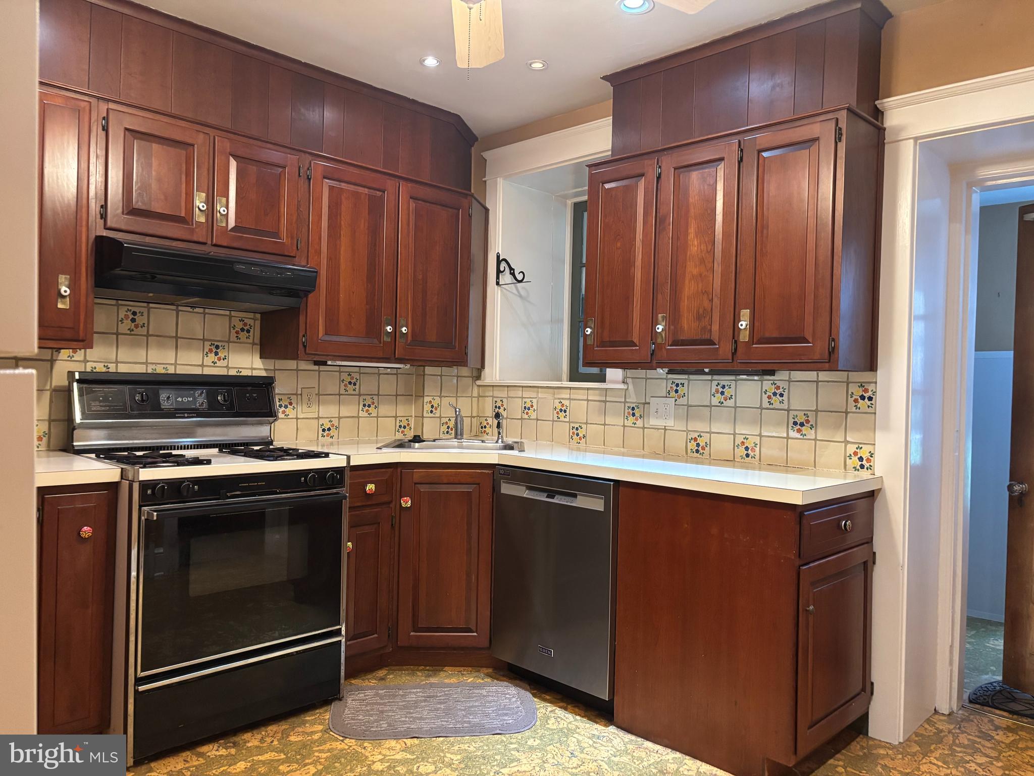 1121 Spring Grove Avenue Lancaster, PA 17603 - Photo 9 of 25 a kitchen with a sink stove and cabinets