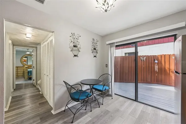 a view of a hallway with furniture and front door