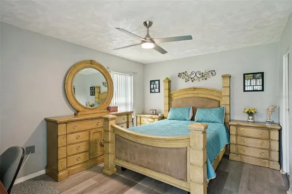 a bedroom with a bed and a dresser