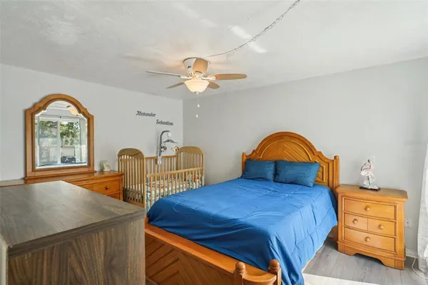 a bedroom with furniture and a window