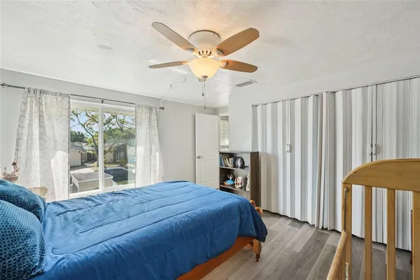 a bed room with a bed and a window