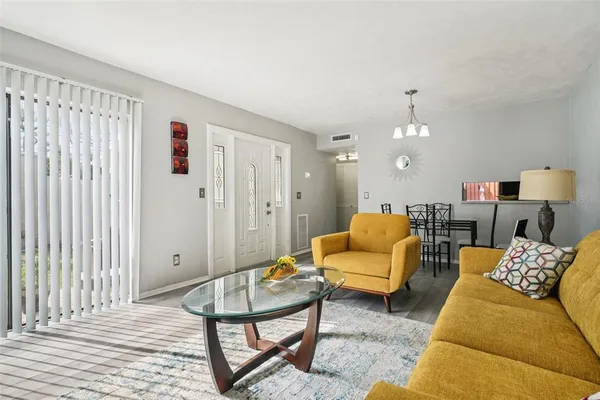 a living room with furniture and a table