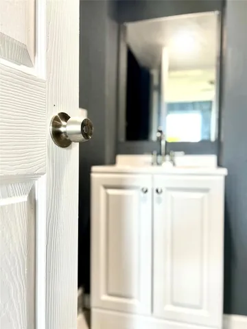 a view of a kitchen with wooden floor and a fireplace
