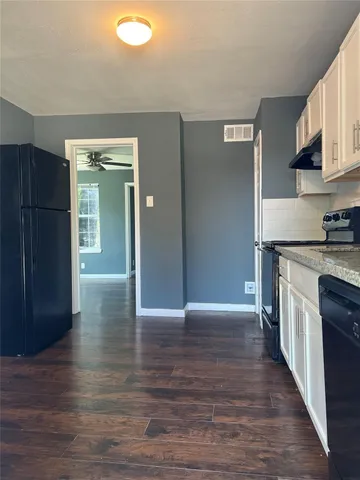 a view of a livingroom with wooden floor