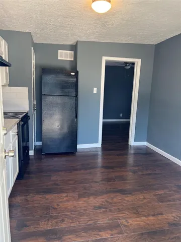 a kitchen with stainless steel appliances granite countertop a stove and a microwave