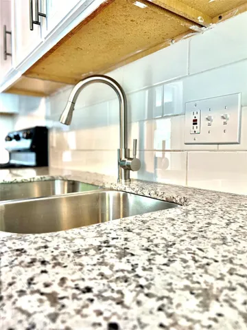 a close view of a stove a microwave and cabinets