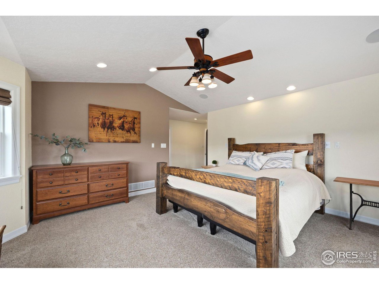 5100 Glen Drive Berthoud, CO 80513 - Photo 19 of 40 a bed room with a bed and a dresser