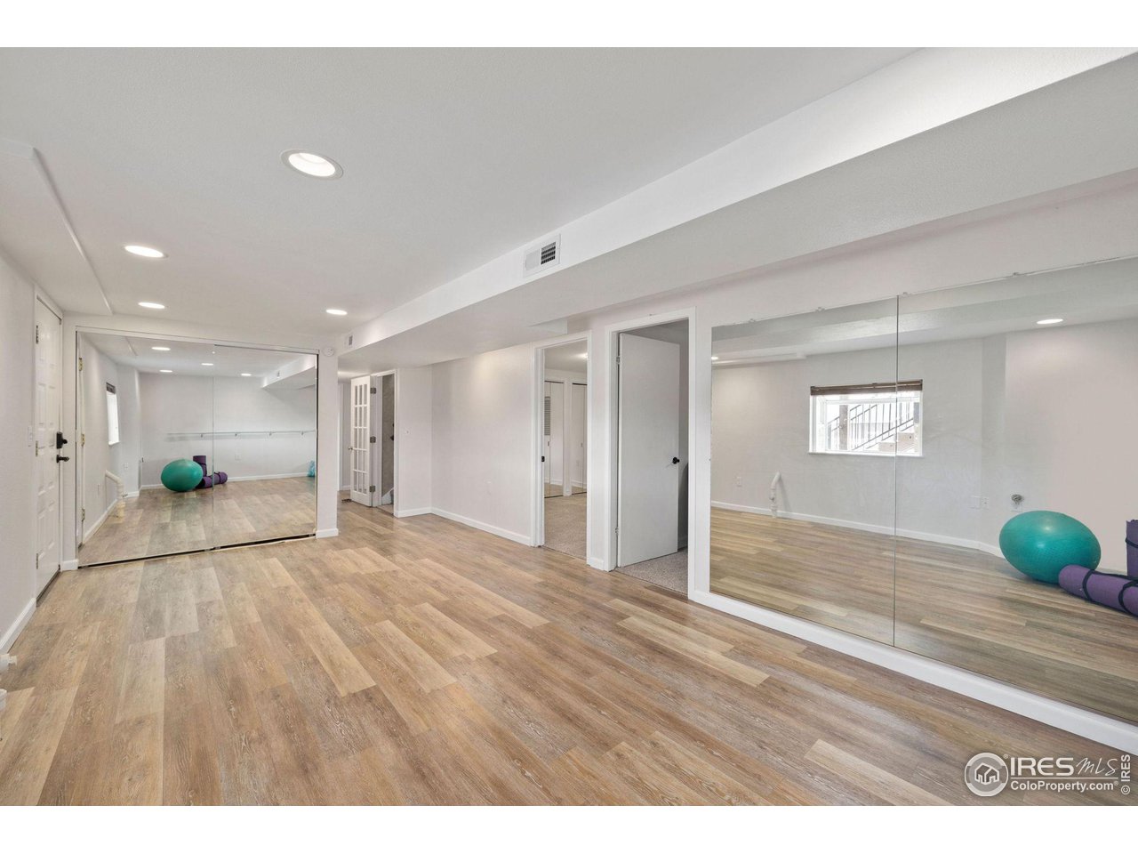 5100 Glen Drive Berthoud, CO 80513 - Photo 26 of 40 a view of an empty room and wooden floor
