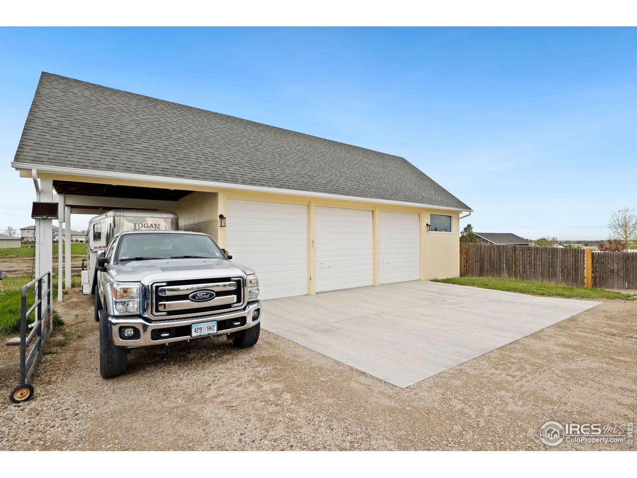 5100 Glen Drive Berthoud, CO 80513 - Photo 33 of 40 a car parked in front of garage
