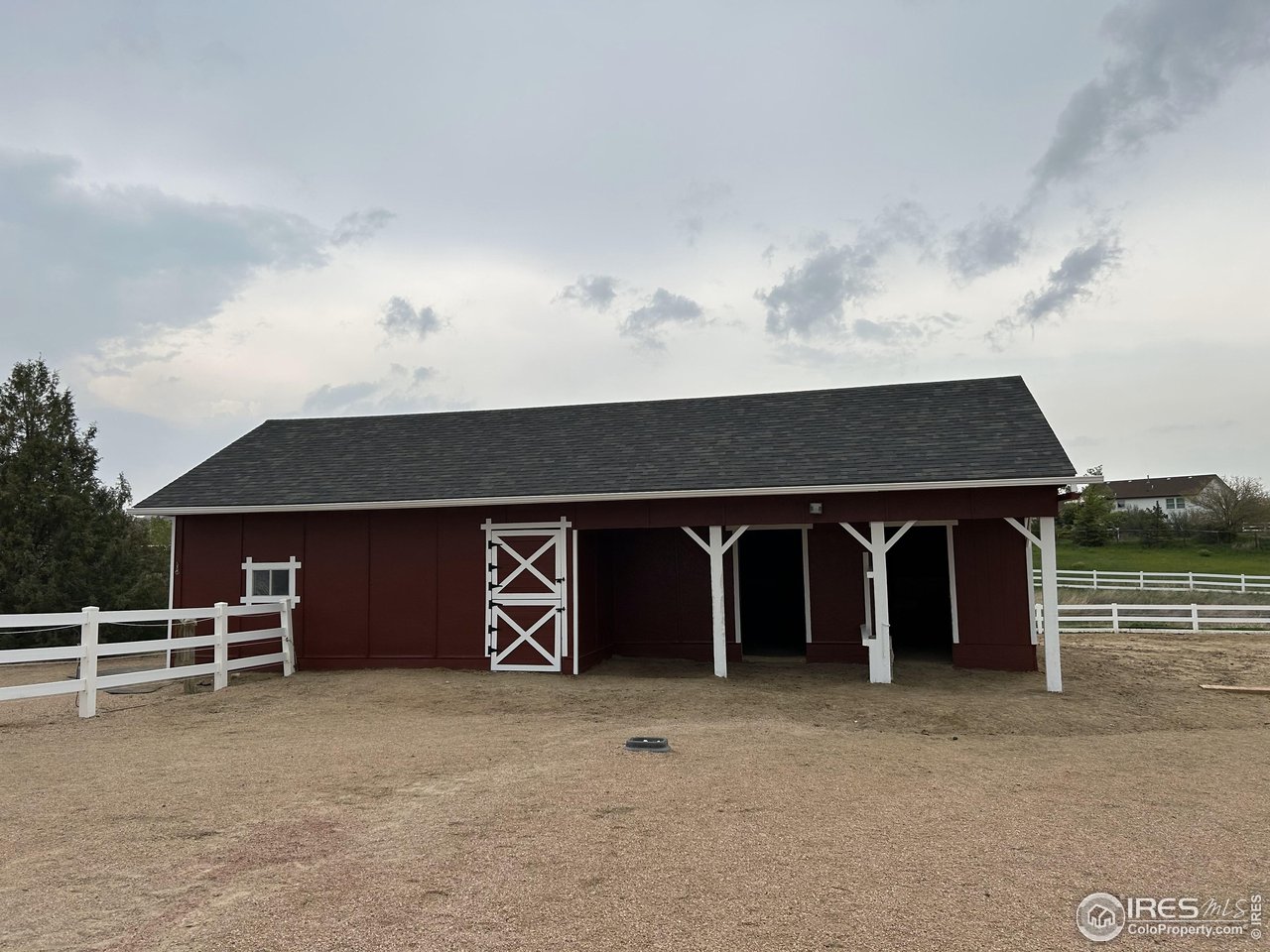 5100 Glen Drive Berthoud, CO 80513 - Photo 4 of 40 a front view of a house with parking