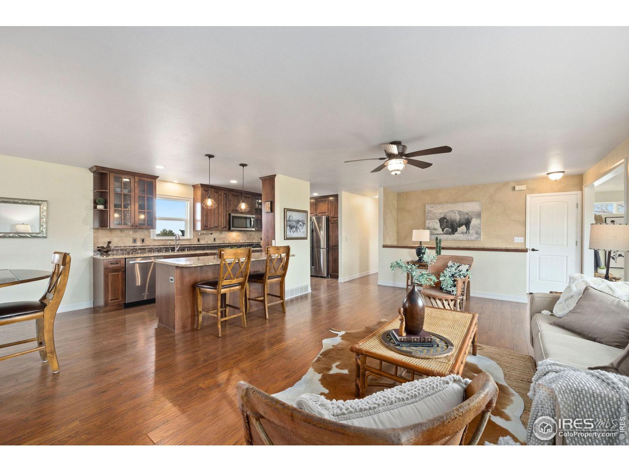 5100 Glen Drive Berthoud, CO 80513 - Photo 10 of 40 a living room with lots of furniture and kitchen view