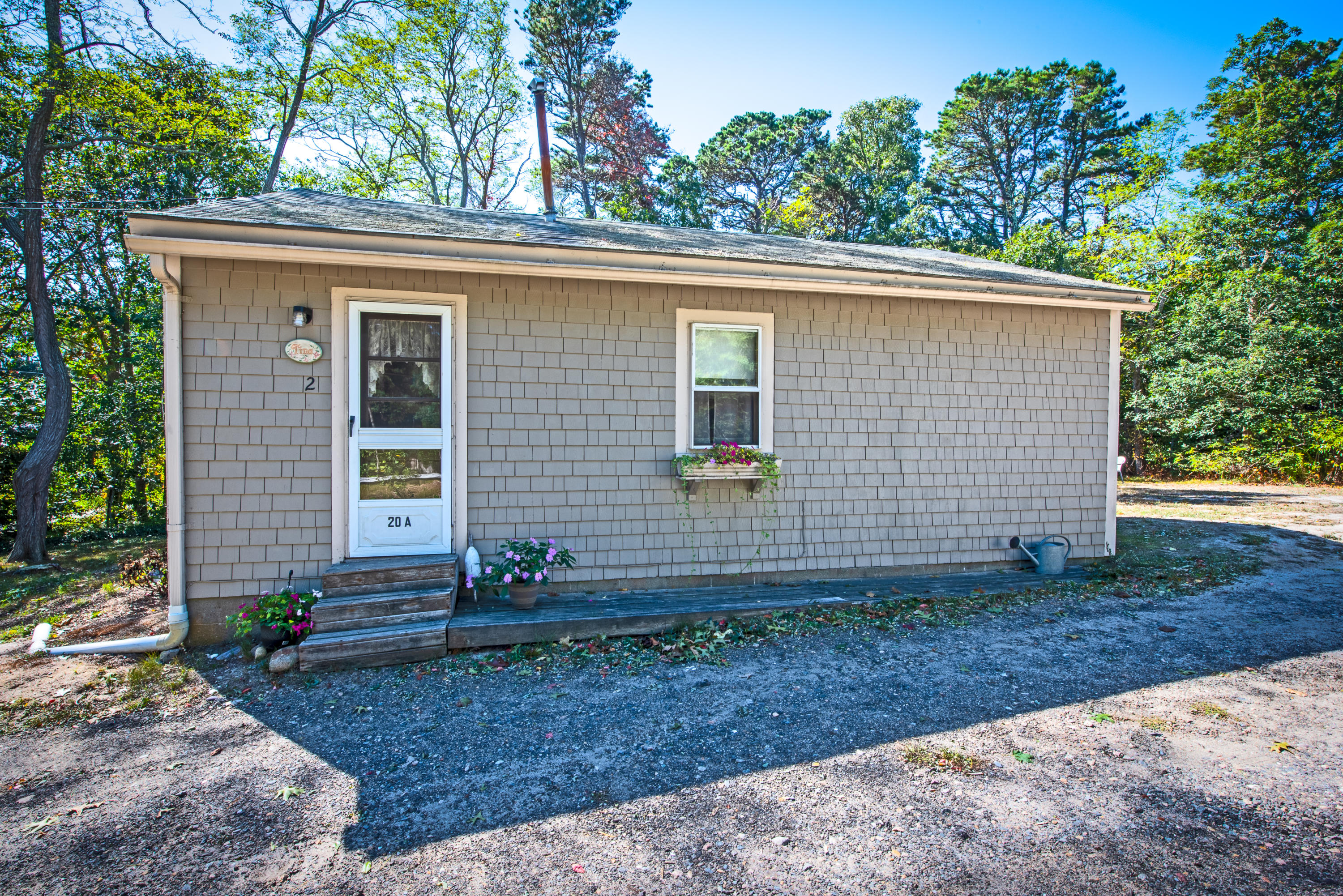 20 Baker Road, Unit B Wellfleet, MA 02667 - Photo 15 of 16 a view of a house with a backyard