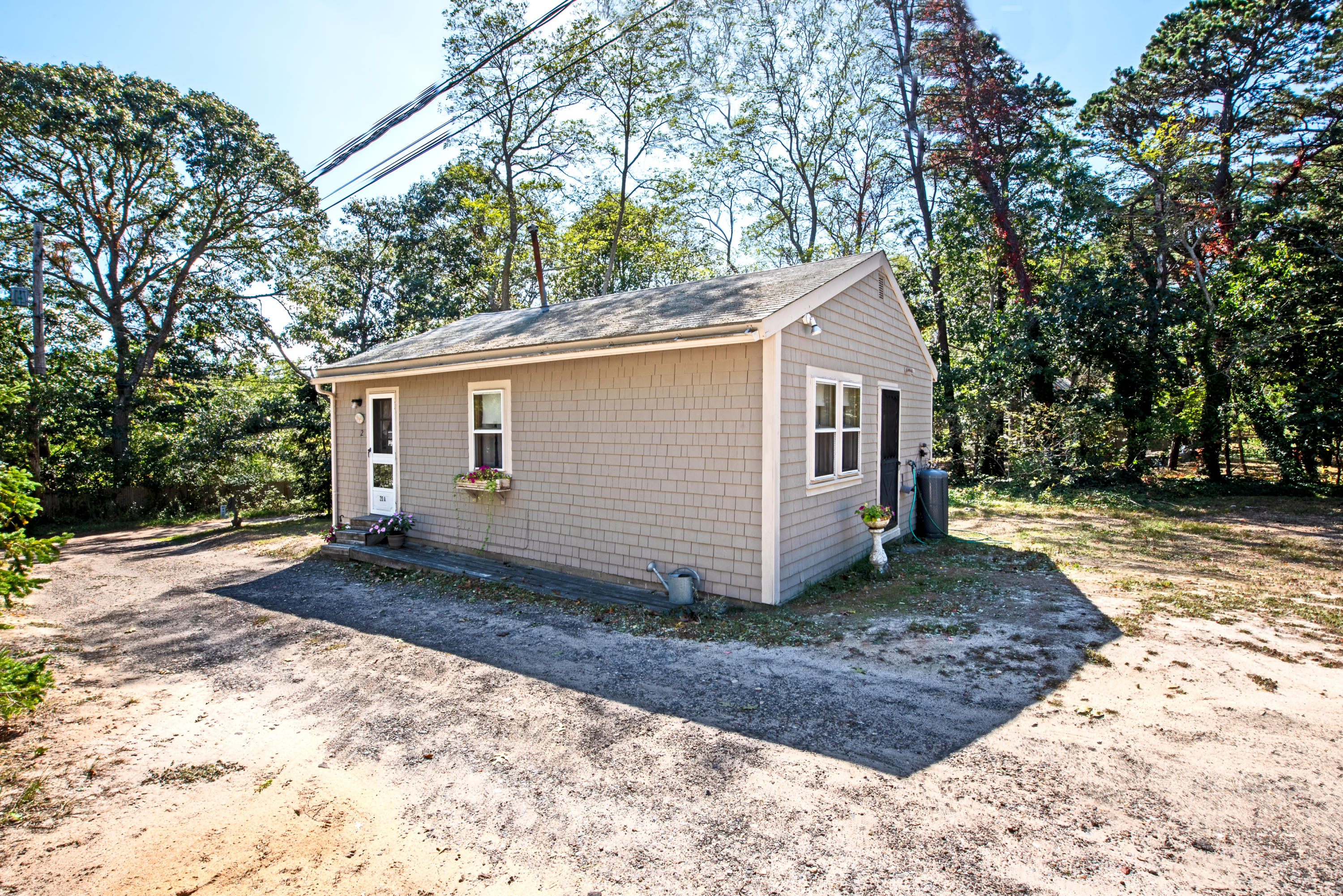 20 Baker Road, Unit B Wellfleet, MA 02667 - Photo 16 of 16 a view of a house with a yard
