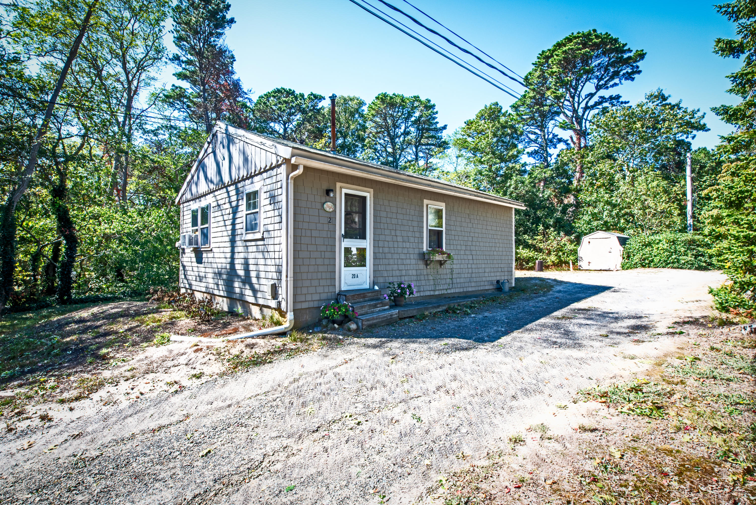 20 Baker Road, Unit B Wellfleet, MA 02667 - Photo 3 of 16 a view of a house with a yard