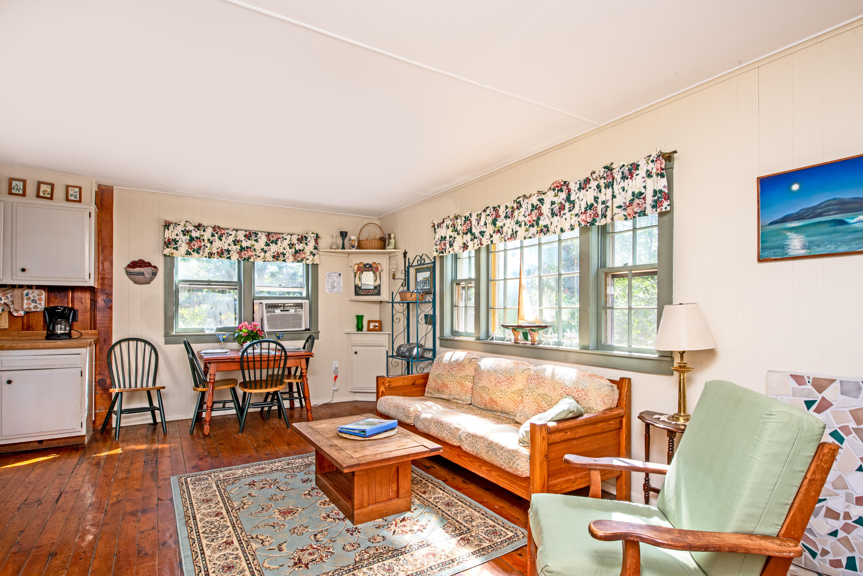 20 Baker Road, Unit B Wellfleet, MA 02667 - Photo 8 of 16 a living room with furniture and a large window