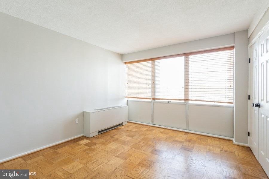 1301 Delaware Avenue Southwest, Unit N720 Washington, DC 20024 - Photo 15 of 20 an empty room with a natural light
