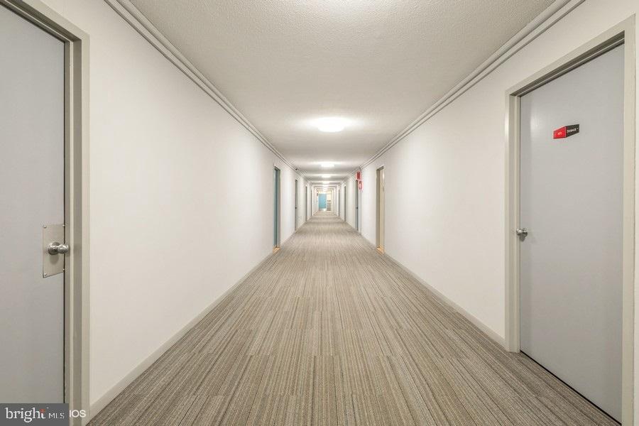 1301 Delaware Avenue Southwest, Unit N720 Washington, DC 20024 - Photo 2 of 20 a view of hallway with wooden floor