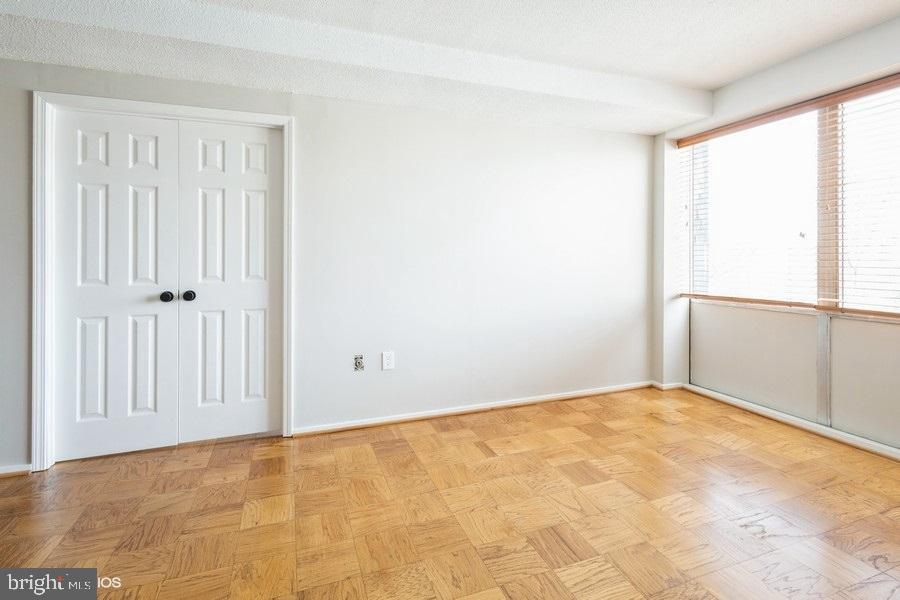 1301 Delaware Avenue Southwest, Unit N720 Washington, DC 20024 - Photo 8 of 20 an empty room with windows