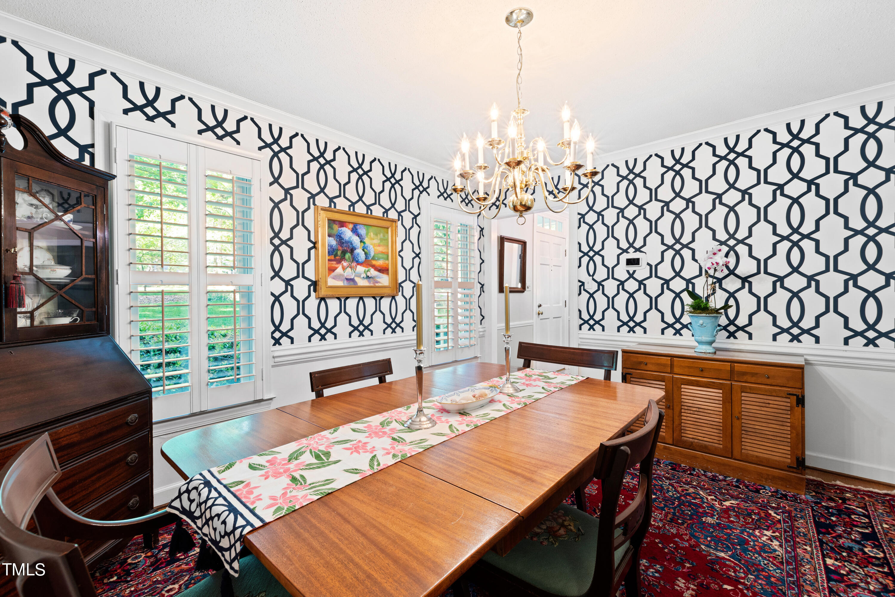10212 Bushveld Lane Raleigh, NC 27613 - Photo 13 of 51 a view of a dining room with furniture window and wooden floor