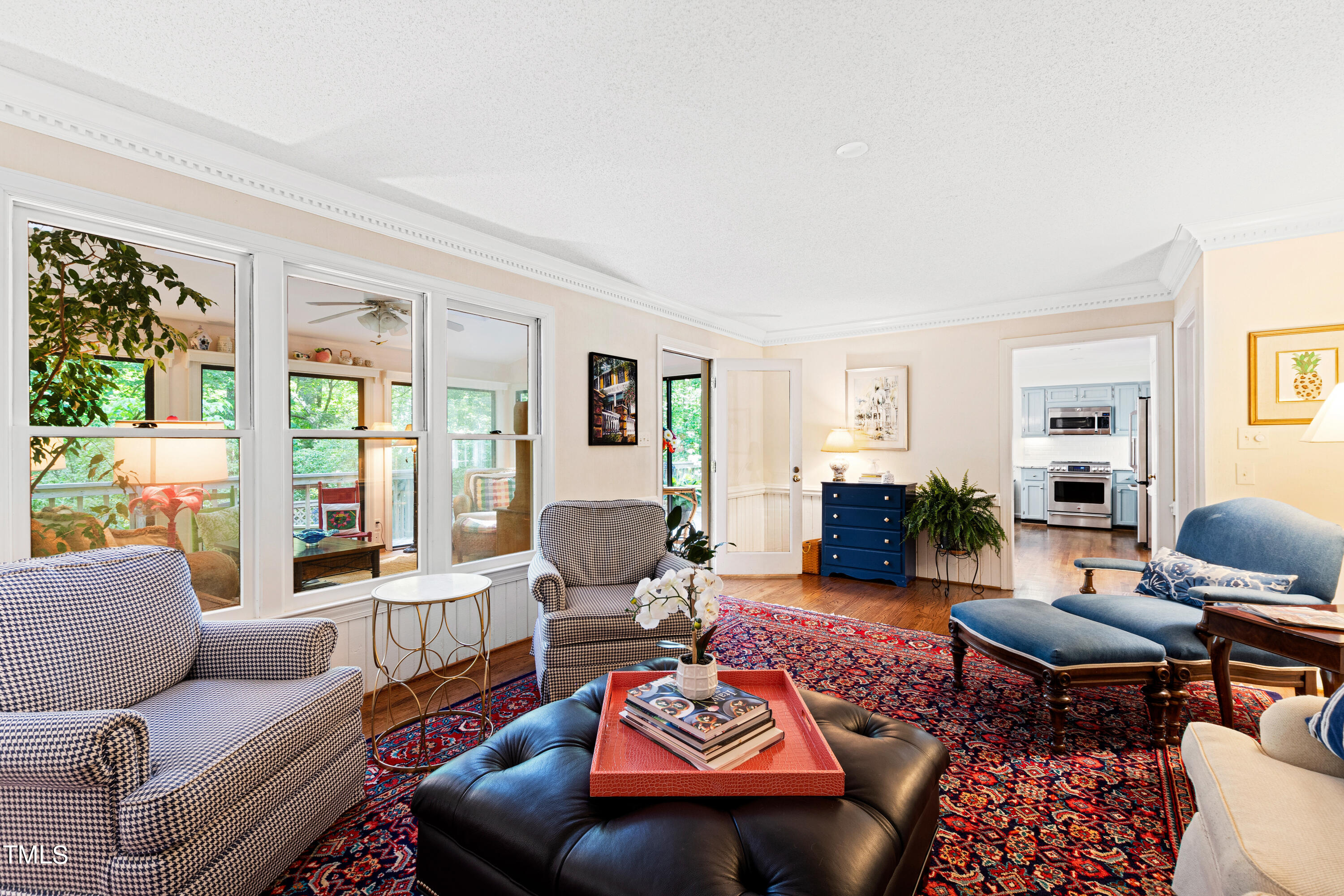 10212 Bushveld Lane Raleigh, NC 27613 - Photo 23 of 51 a living room with furniture fireplace and a large window