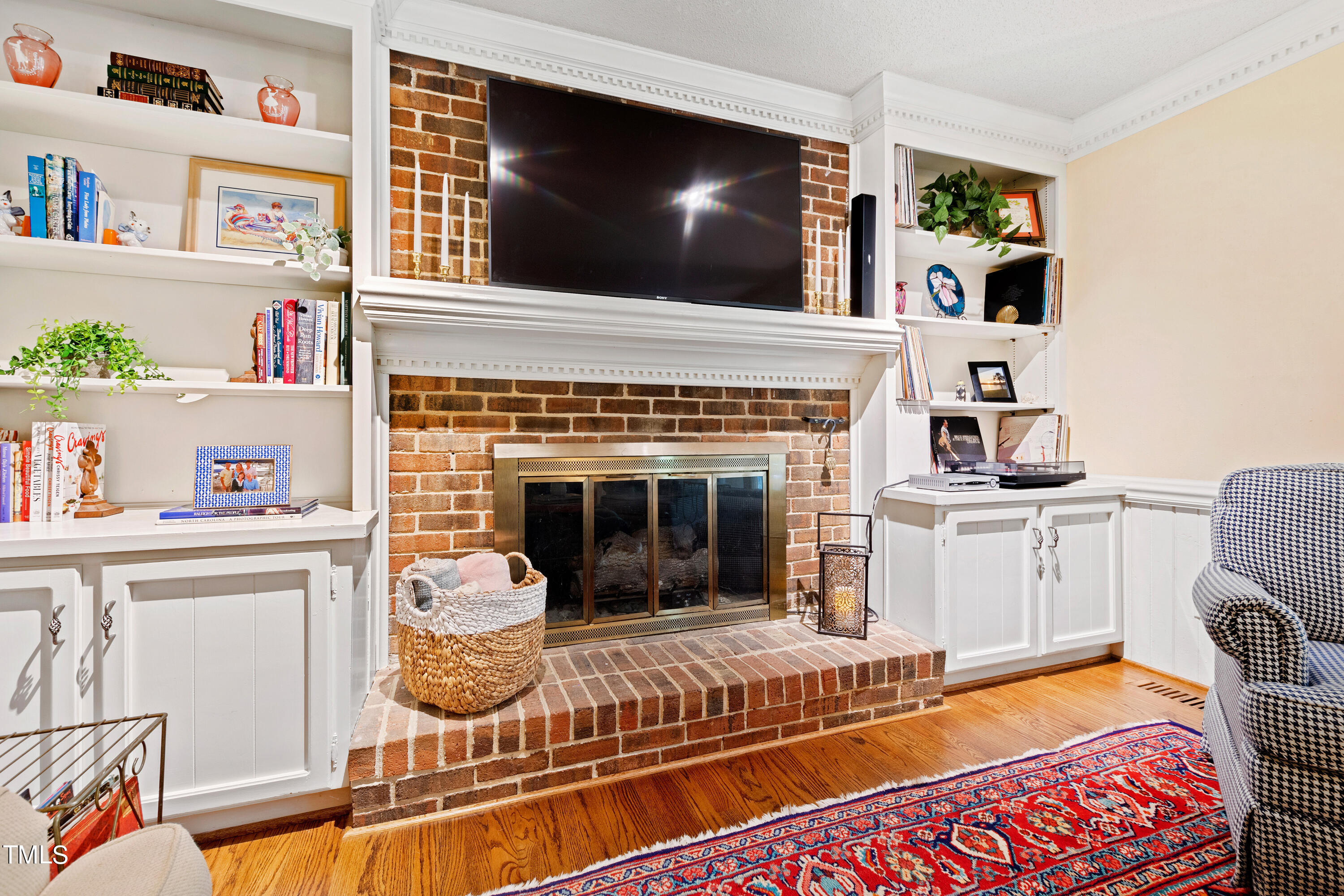 10212 Bushveld Lane Raleigh, NC 27613 - Photo 24 of 51 a living room with furniture and a fireplace