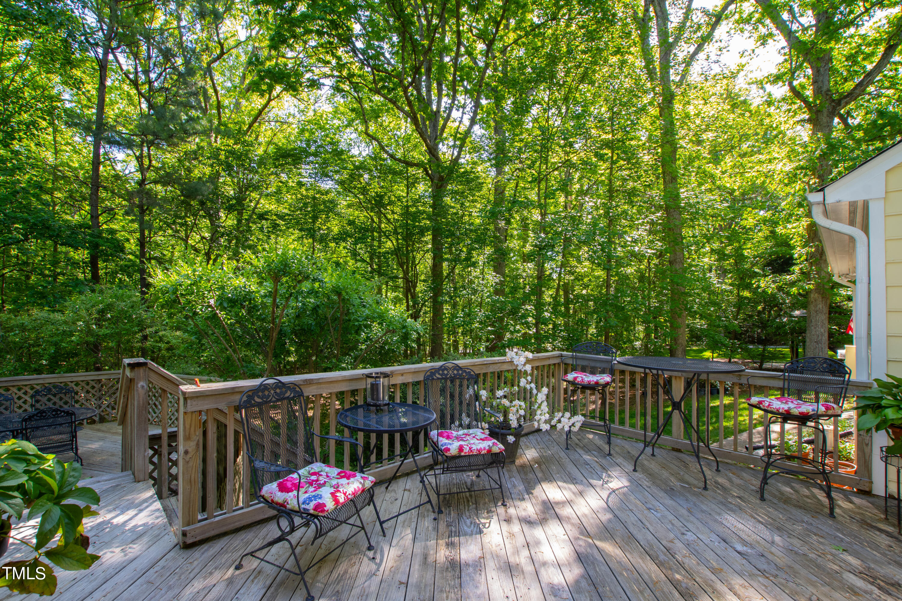 10212 Bushveld Lane Raleigh, NC 27613 - Photo 45 of 51 a view of deck with wooden floor and outdoor seating