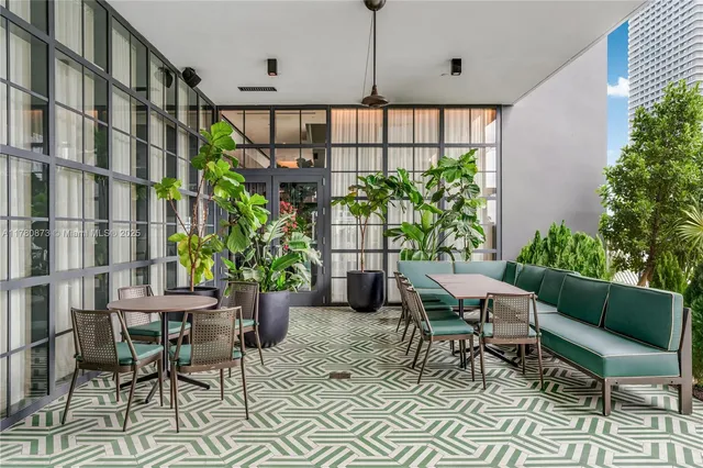 a bedroom with furniture and a potted plant