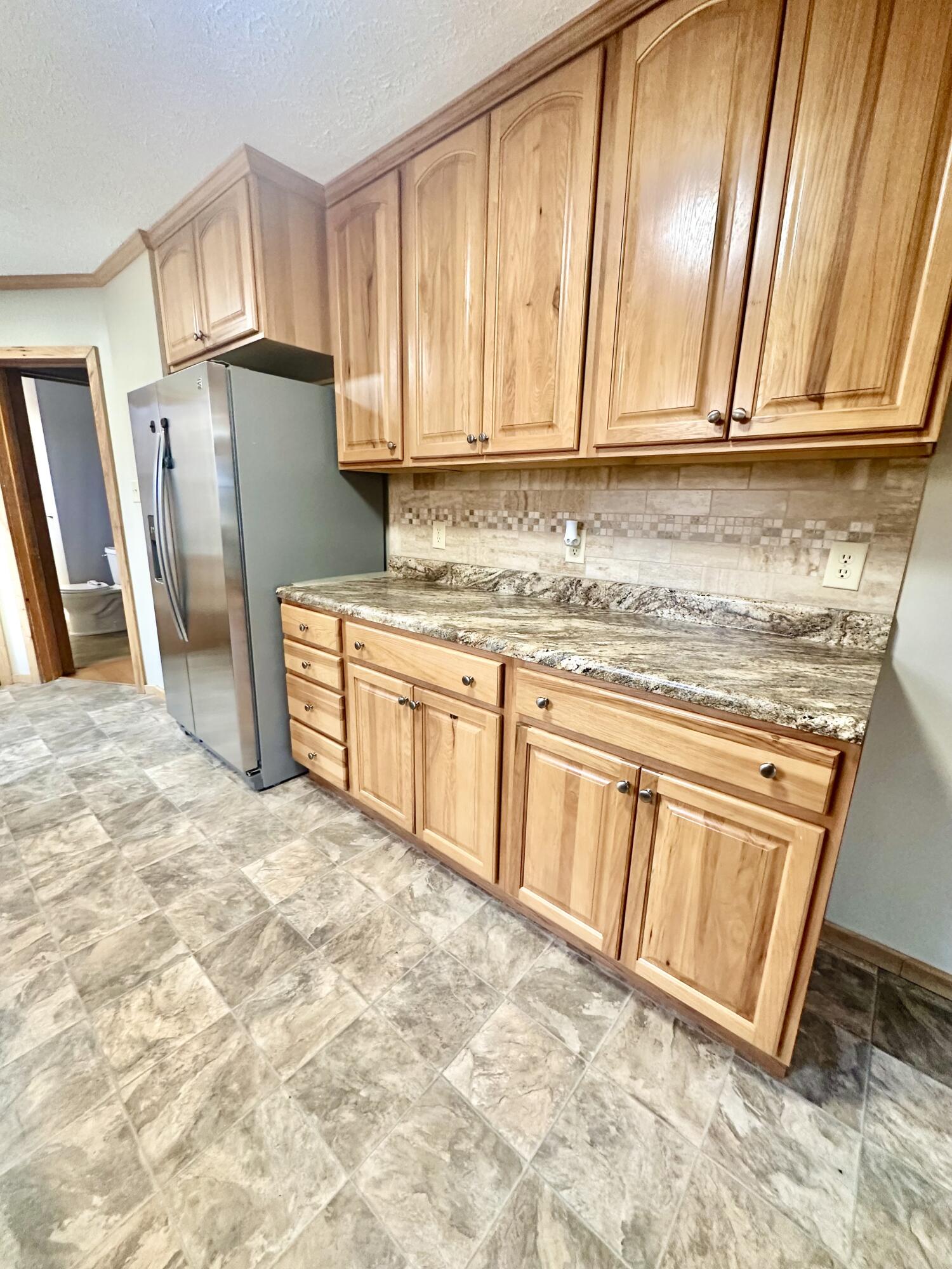 2714 Jackson River Road Covington, VA 24426 - Photo 27 of 54 a kitchen with stainless steel appliances granite countertop a refrigerator a stove a sink and dishwasher