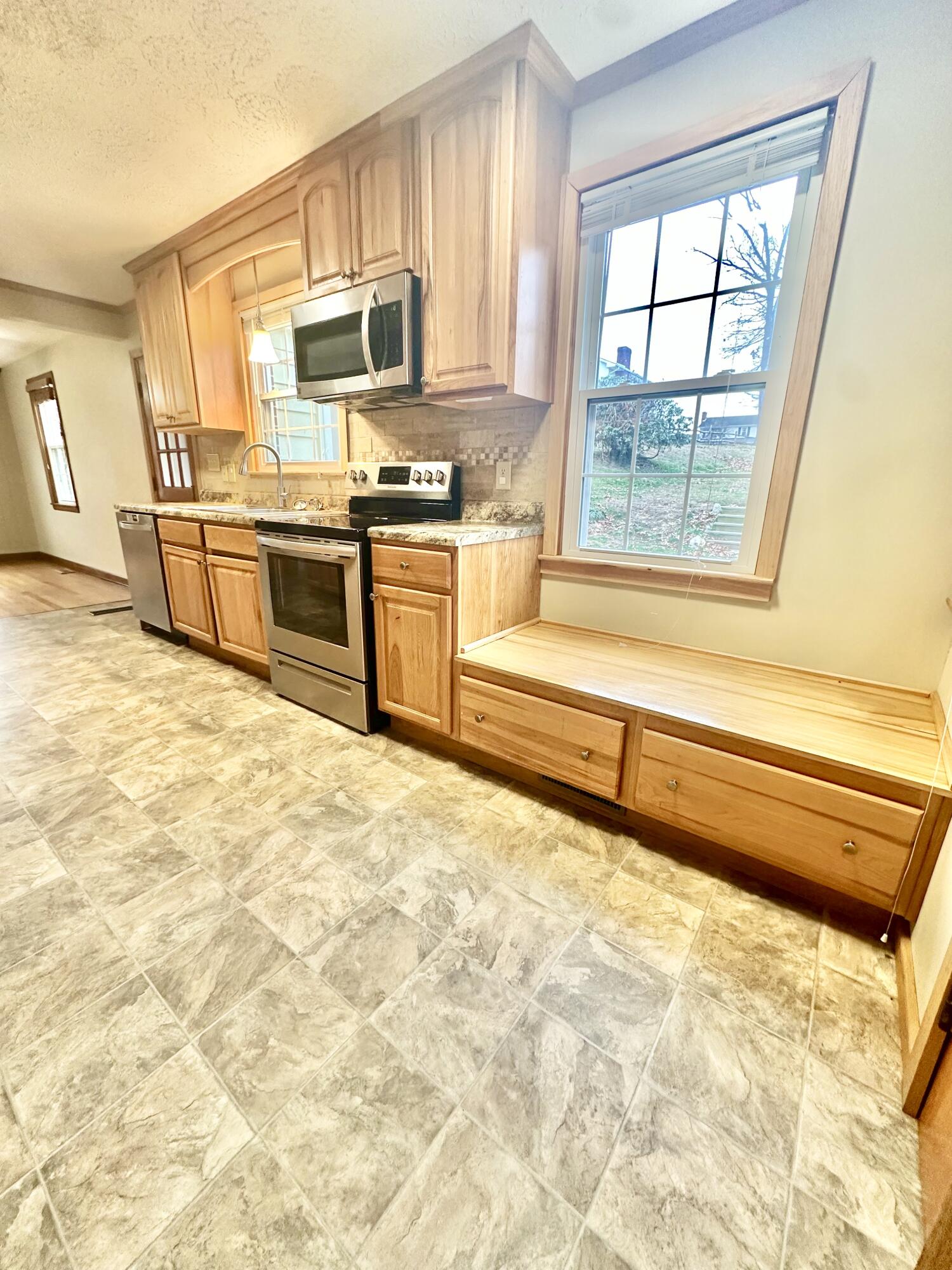 2714 Jackson River Road Covington, VA 24426 - Photo 29 of 54 a kitchen with stainless steel appliances a stove a sink and a refrigerator