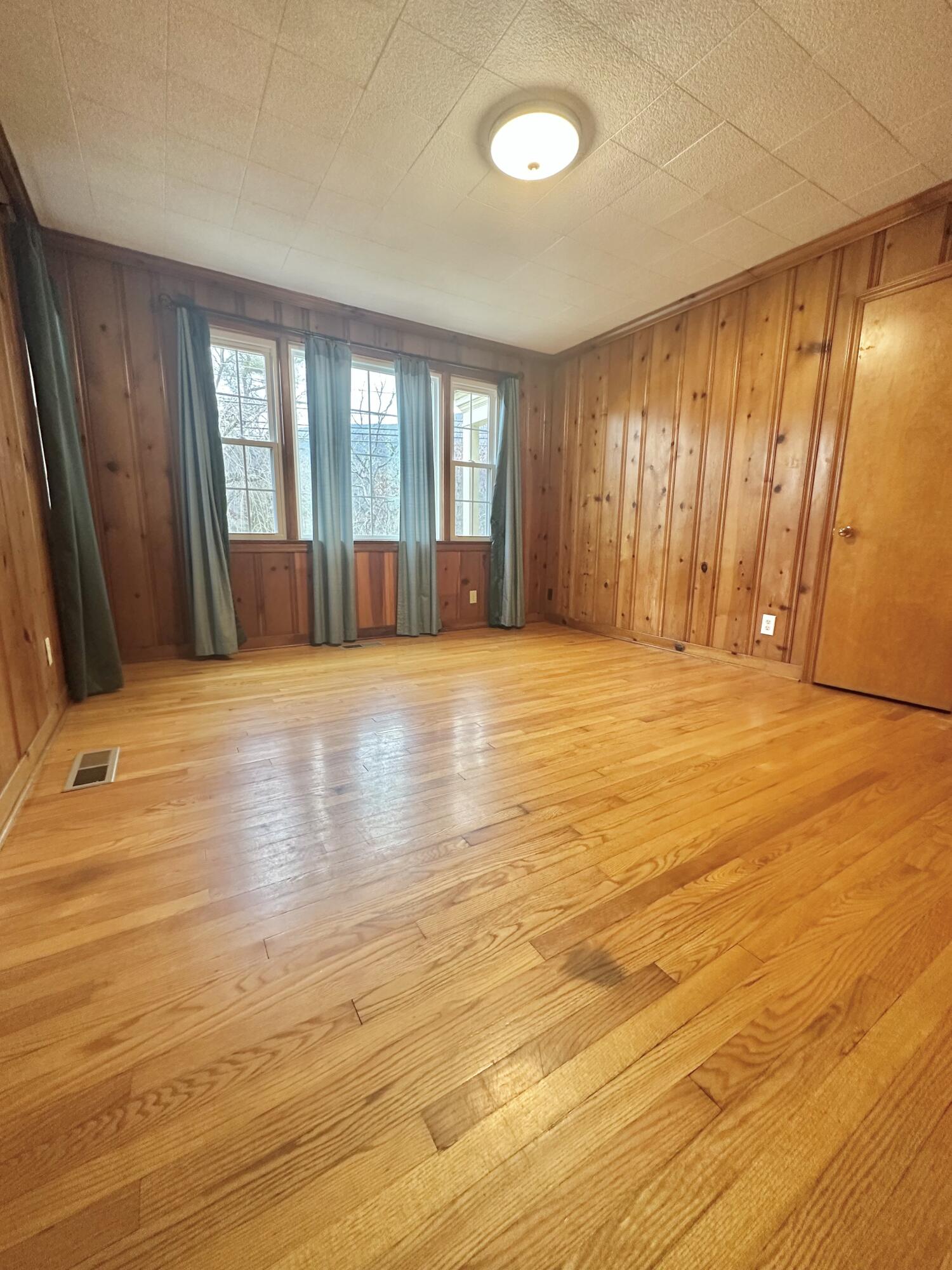 2714 Jackson River Road Covington, VA 24426 - Photo 36 of 54 a view of an empty room with window and wooden floor
