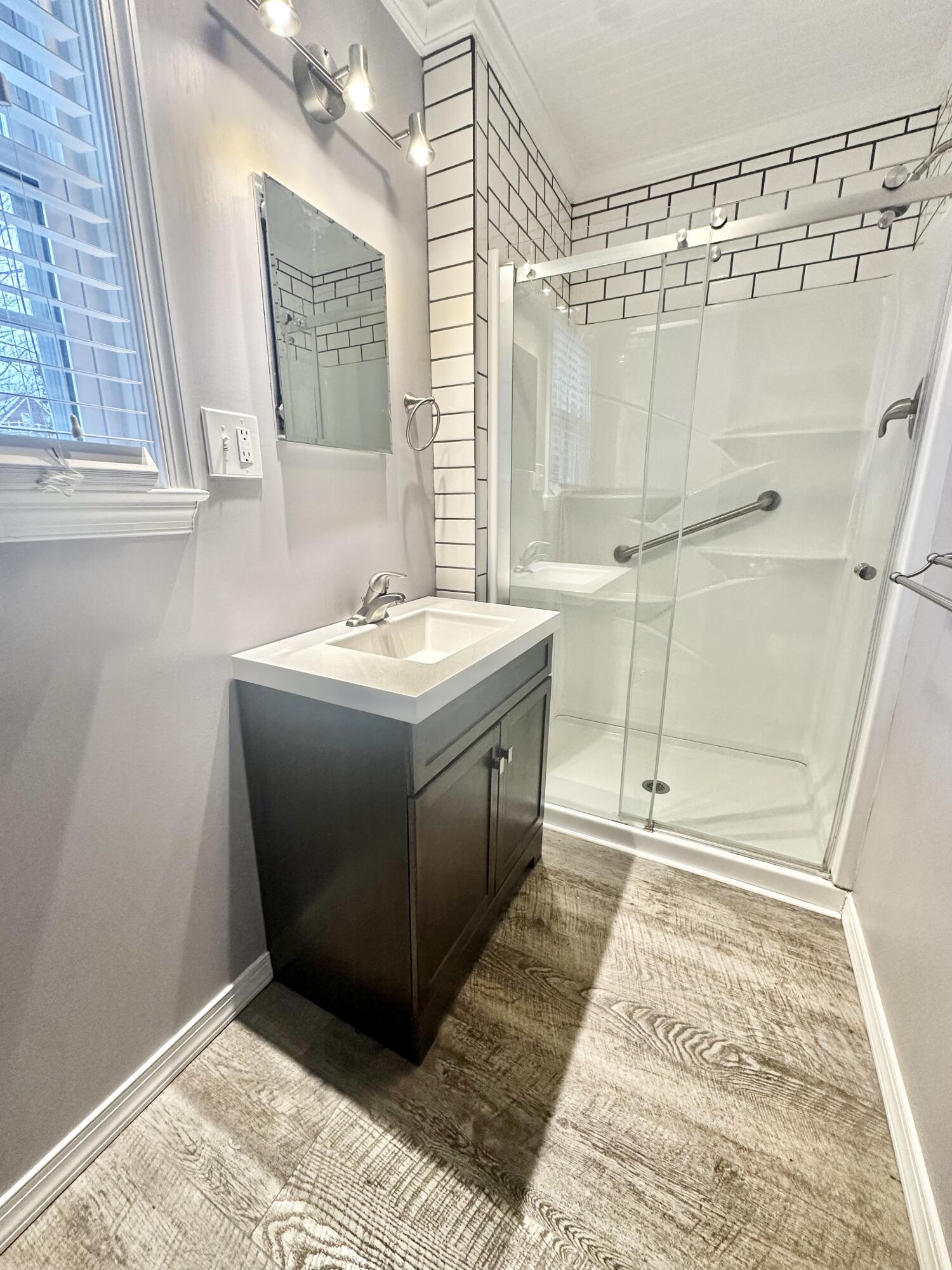 2714 Jackson River Road Covington, VA 24426 - Photo 38 of 54 a bathroom with a sink a vanity and a mirror