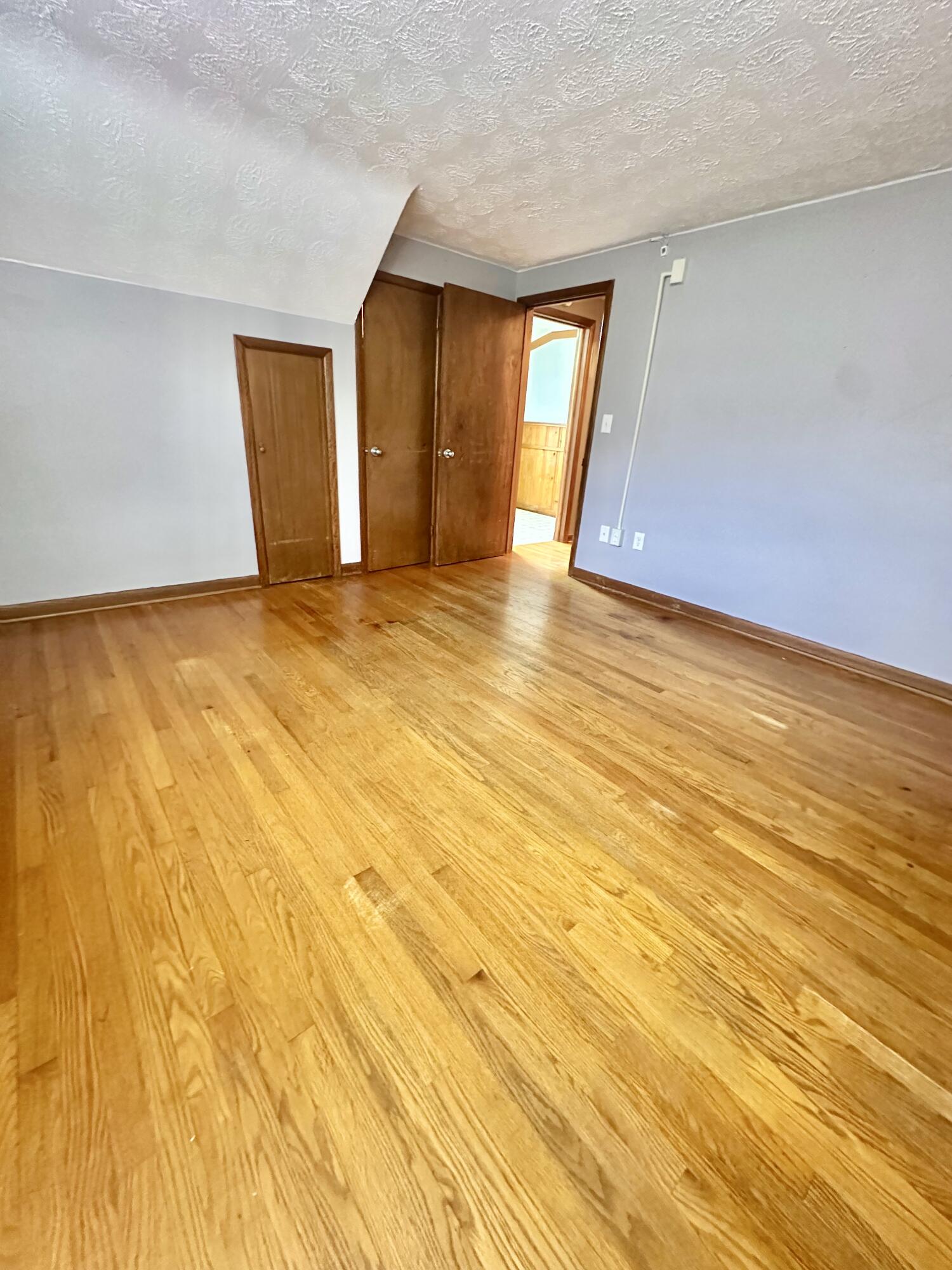 2714 Jackson River Road Covington, VA 24426 - Photo 43 of 54 a view of an empty room with wooden floor and a window