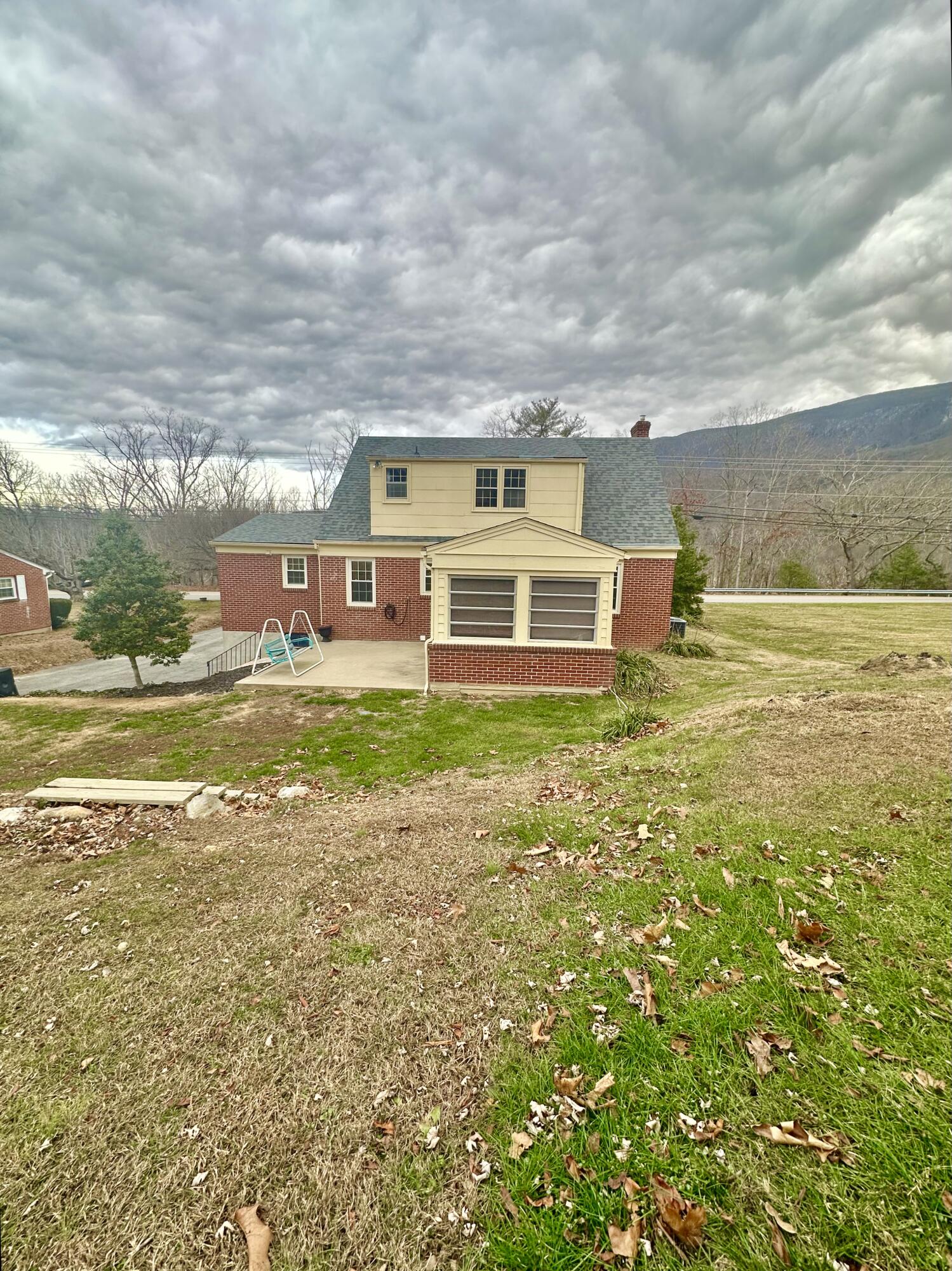 2714 Jackson River Road Covington, VA 24426 - Photo 10 of 54 a view of a house with a big yard and large trees