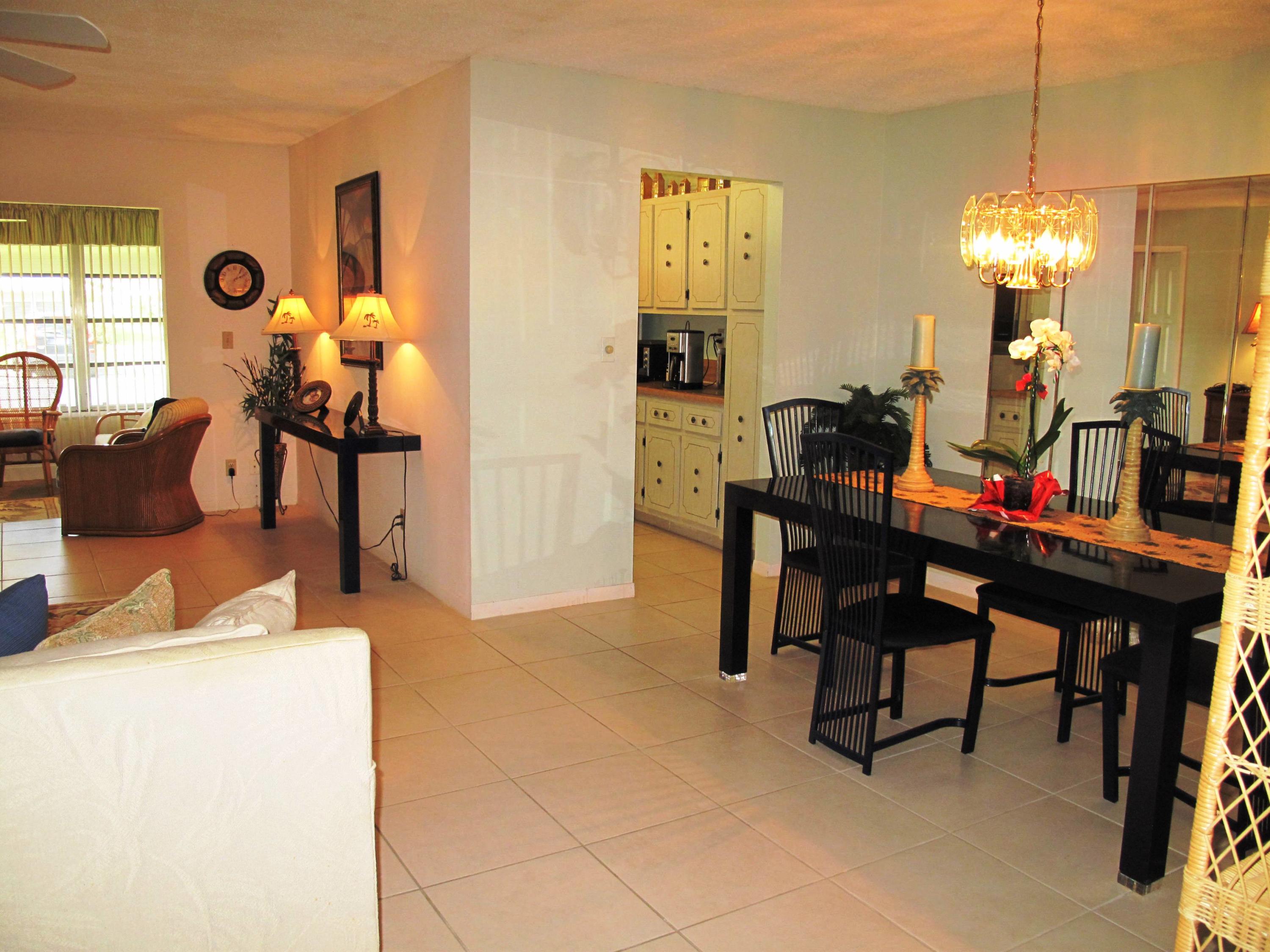 1317 High Point Way Southeast, Unit C Delray Beach, FL 33445 - Photo 12 of 40 Dining and living area view