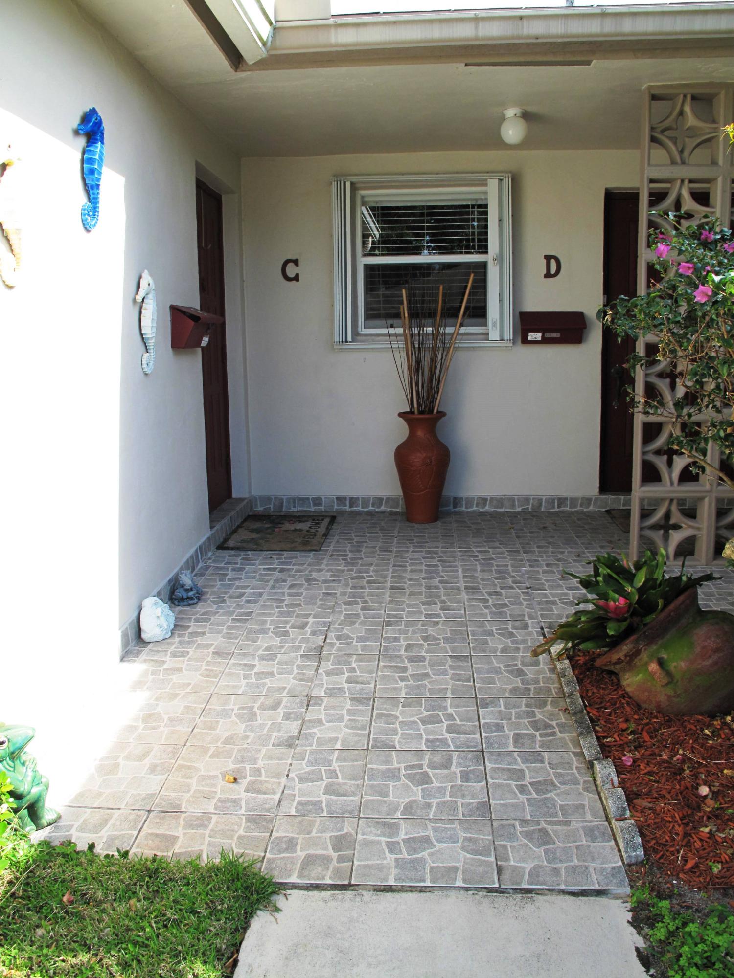 1317 High Point Way Southeast, Unit C Delray Beach, FL 33445 - Photo 3 of 40 Non skid tile entrance to villa
