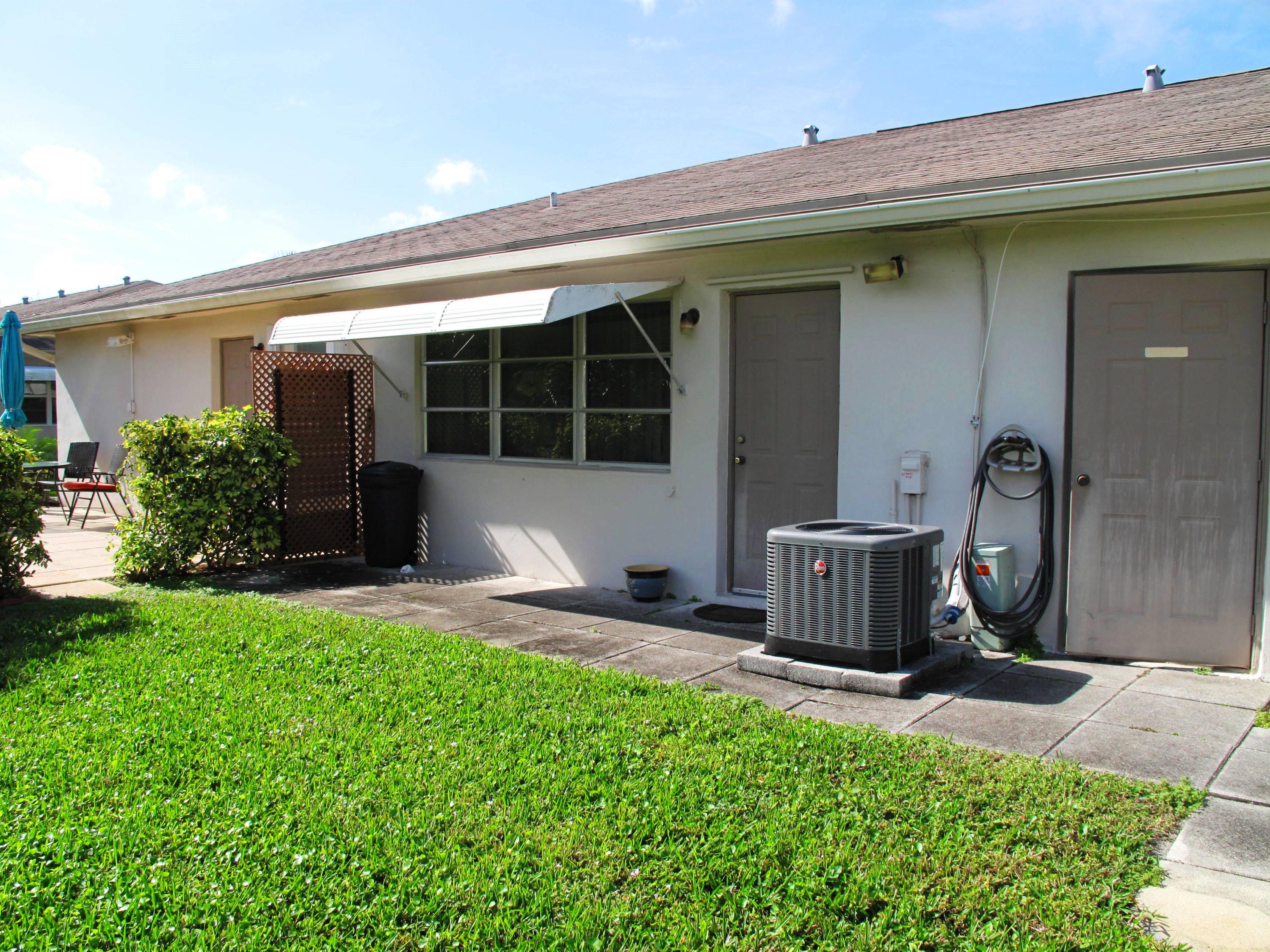 1317 High Point Way Southeast, Unit C Delray Beach, FL 33445 - Photo 29 of 40 rear exterior view of villa with plenty