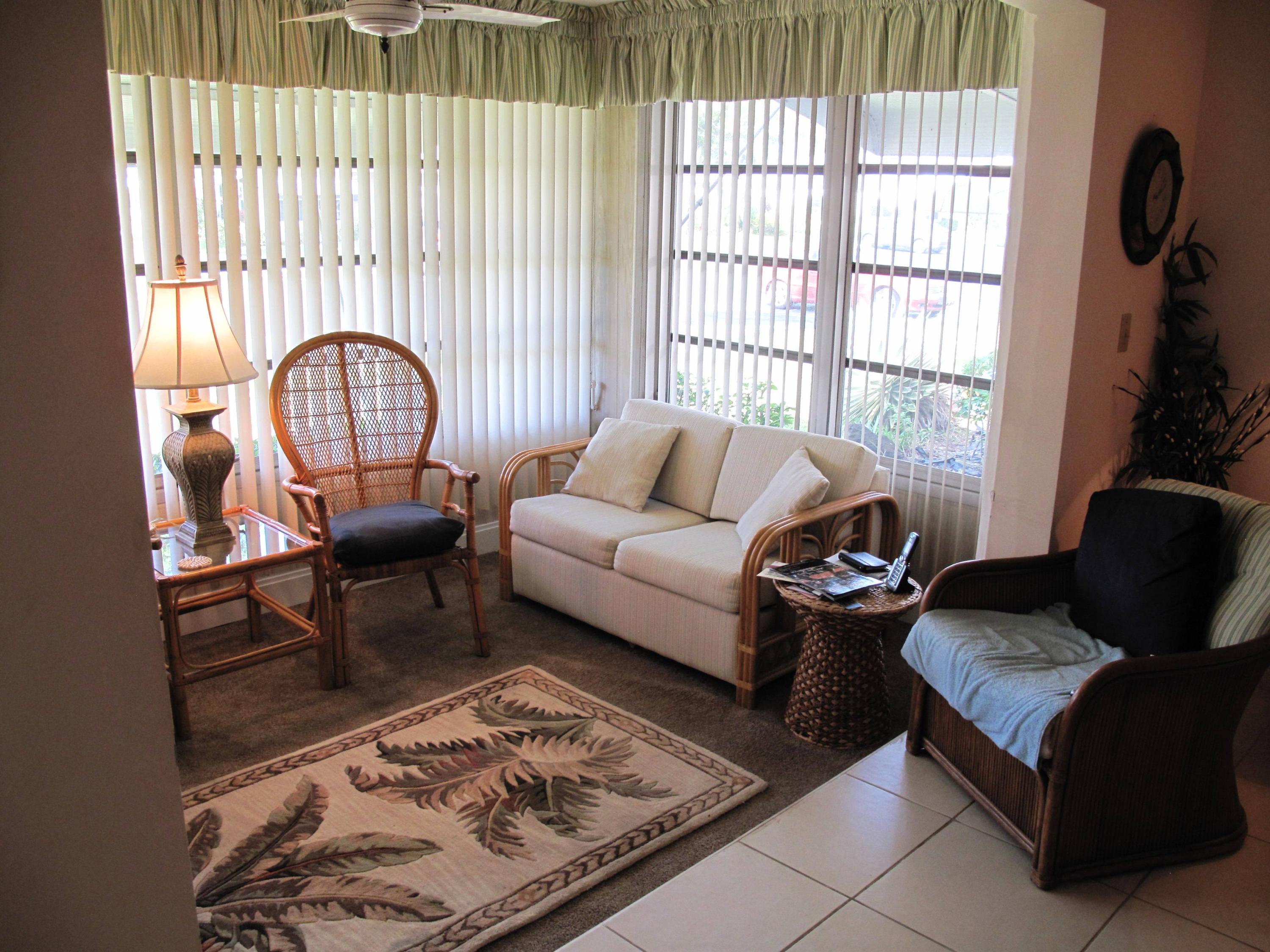 1317 High Point Way Southeast, Unit C Delray Beach, FL 33445 - Photo 4 of 40 Enclosed Florida room under air