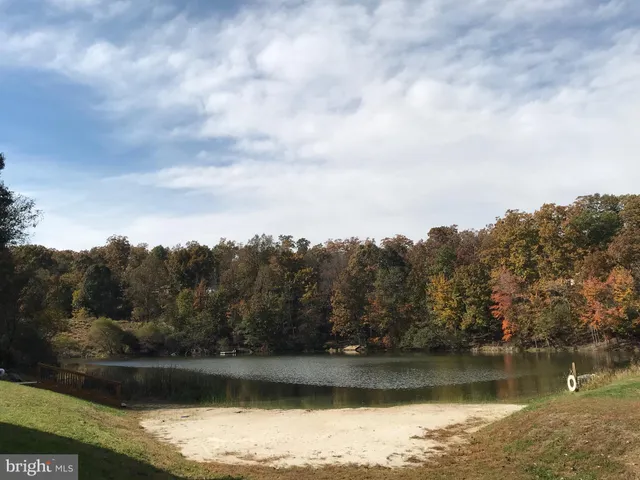 an aerial view of a houses with ocean view
