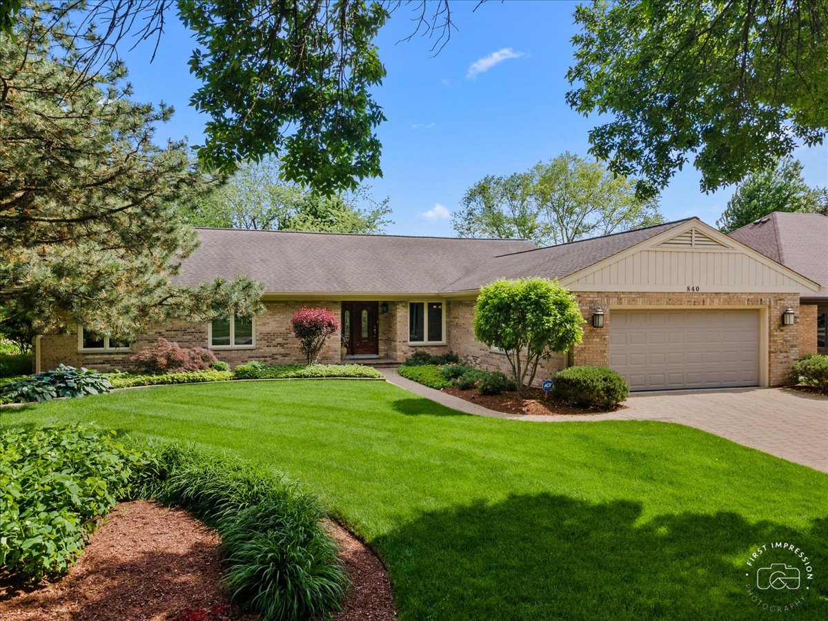 840 West Bauer Road Naperville, IL 60563 - Photo 1 of 37 a front view of a house with a yard and porch