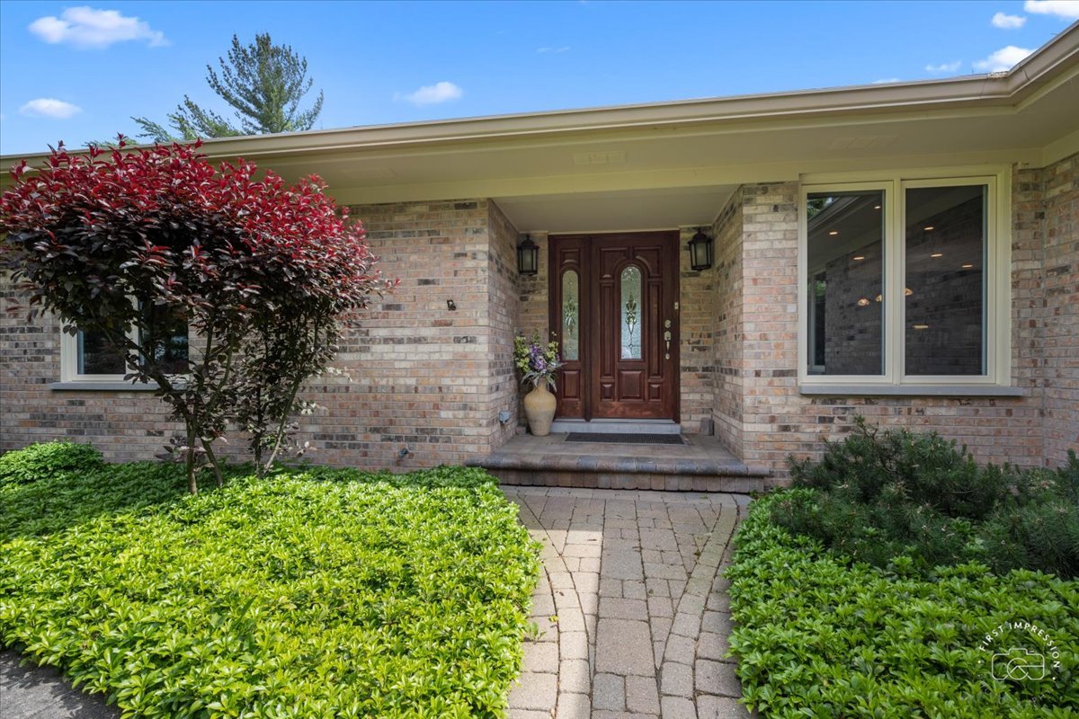 840 West Bauer Road Naperville, IL 60563 - Photo 11 of 37 a front view of a house with a garden