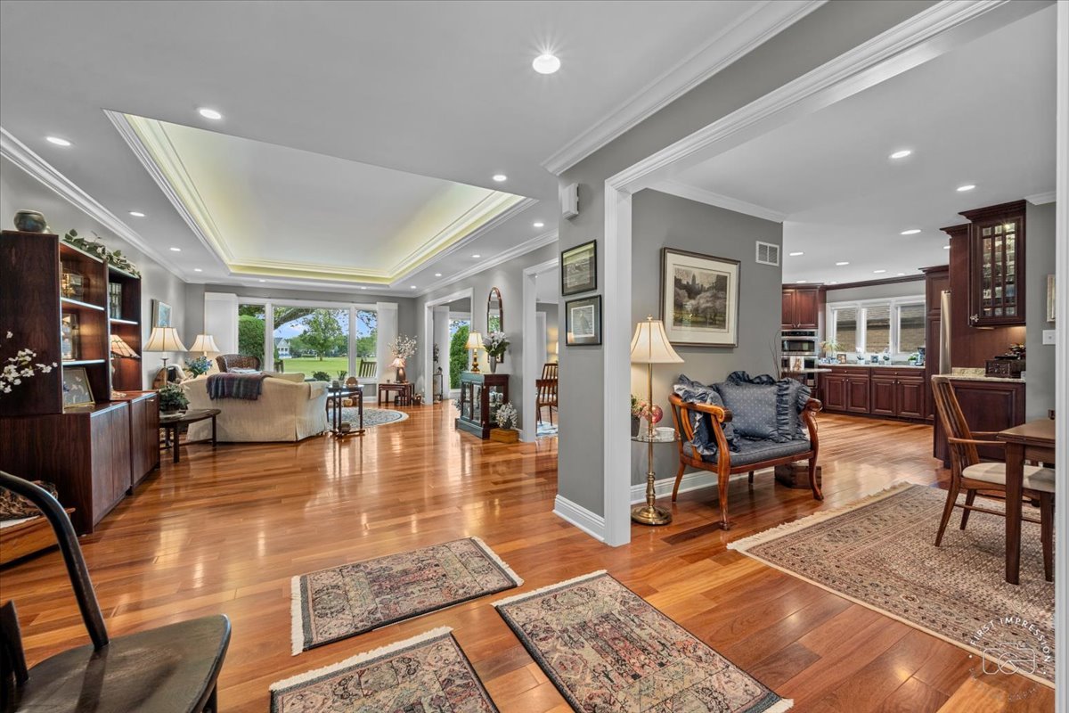 840 West Bauer Road Naperville, IL 60563 - Photo 12 of 37 a living room with lots of furniture wooden floor and a table