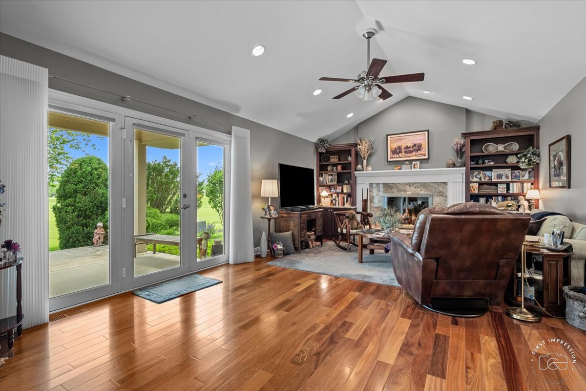840 West Bauer Road Naperville, IL 60563 - Photo 18 of 37 a living room with furniture and a fireplace