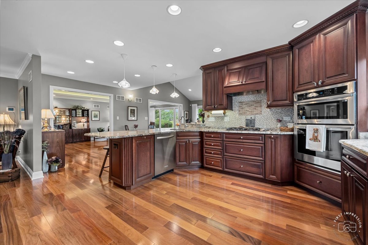 840 West Bauer Road Naperville, IL 60563 - Photo 24 of 37 a kitchen with stainless steel appliances wooden cabinets a stove top oven a sink and dishwasher