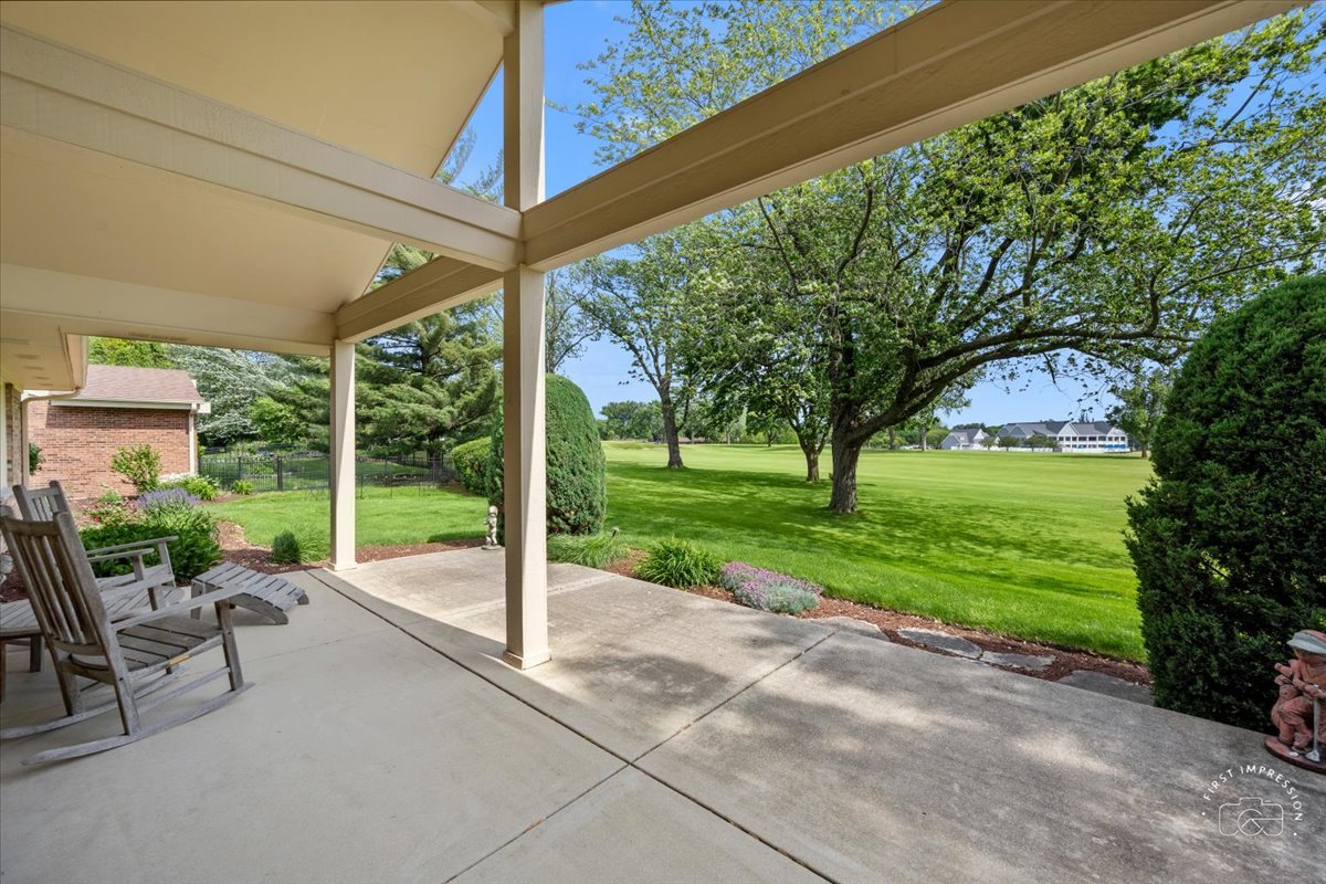 840 West Bauer Road Naperville, IL 60563 - Photo 37 of 37 a view of a patio with a table chairs and a backyard
