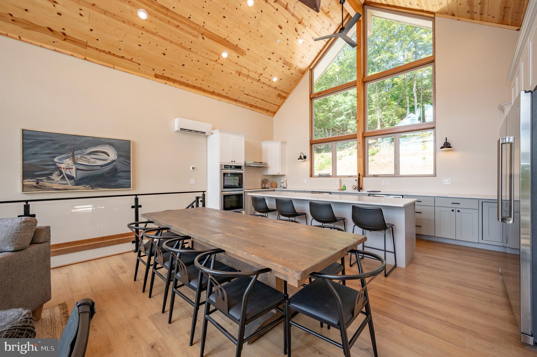 2614 Marsh Hill Road McHenry, MD 21541 - Photo 11 of 76 a view of a dining room with furniture window and wooden floor