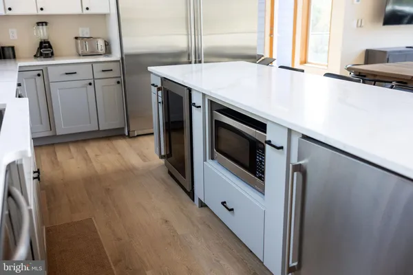 a stove top oven sitting inside of a kitchen